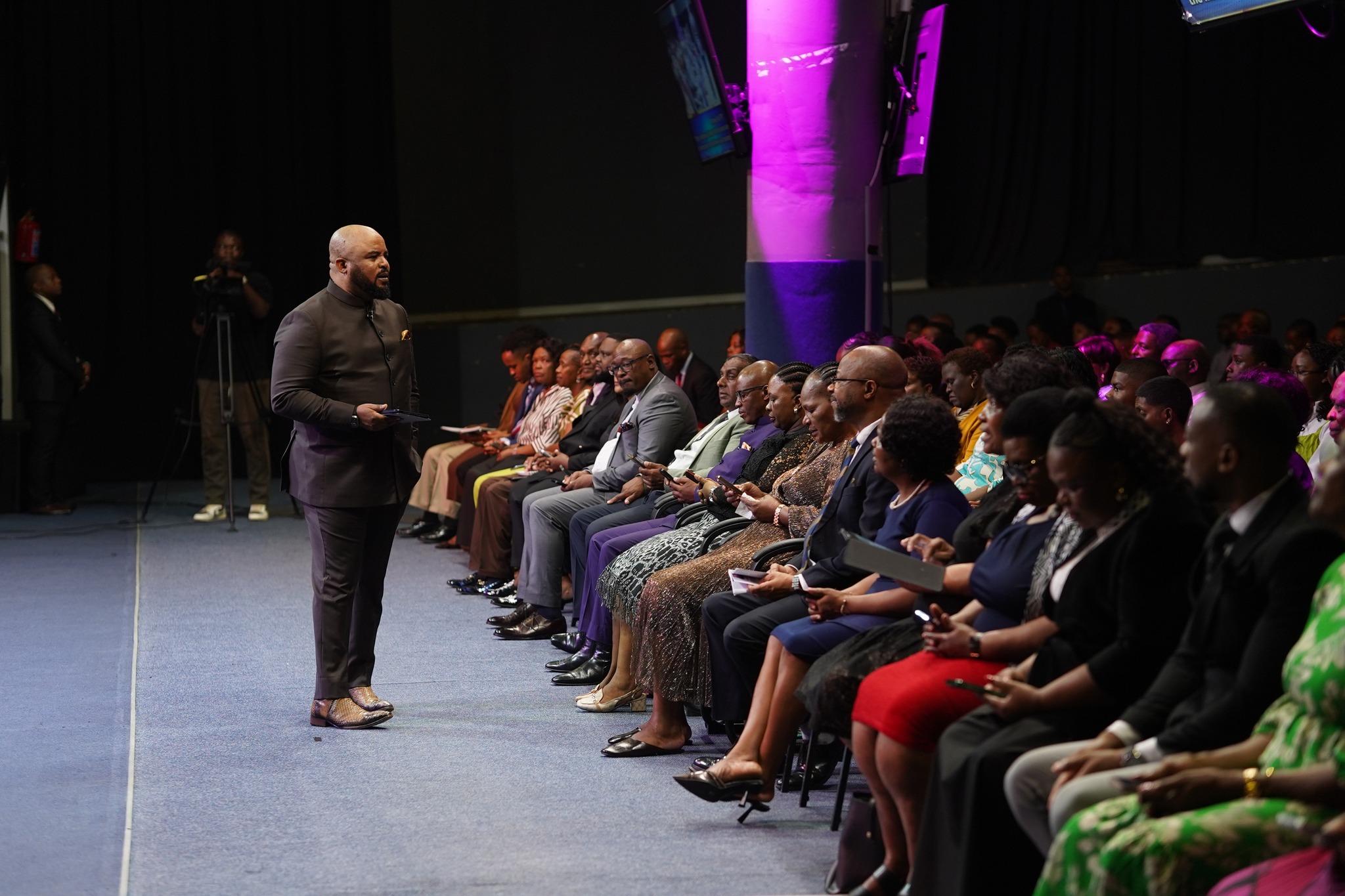 Worship leader ministering on stage from Christ Embassy Durban Facebook reels